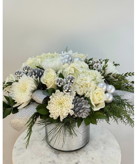 Rusctic silver and red centerpiece featuring a red hurricane candle holder